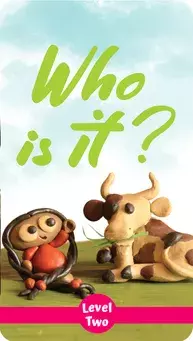 A child sitting on the grass next to a cow, both made of clay. The title "Who is it?" and "Level Two" are displayed.